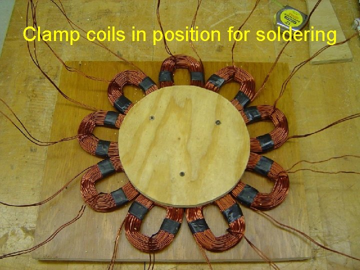 Clamp coils in position for soldering 