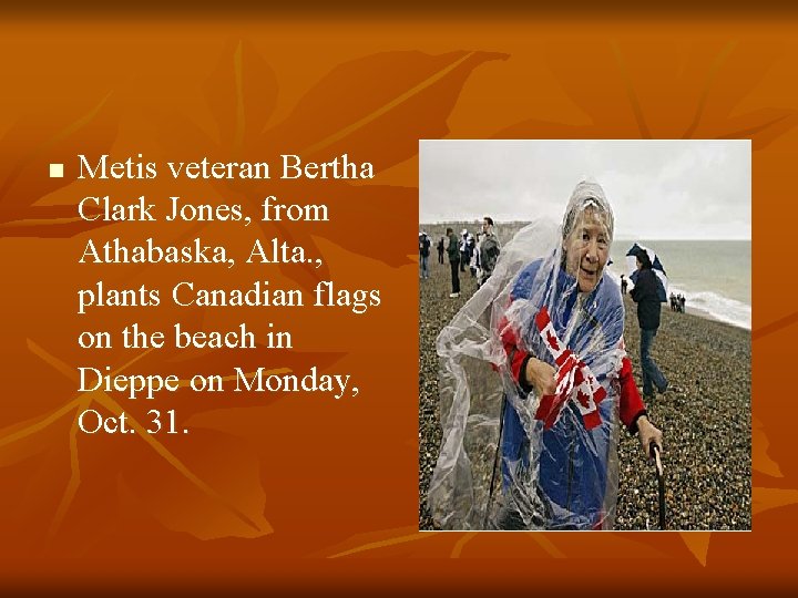 n Metis veteran Bertha Clark Jones, from Athabaska, Alta. , plants Canadian flags on