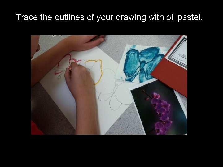 Trace the outlines of your drawing with oil pastel. 