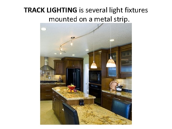 TRACK LIGHTING is several light fixtures mounted on a metal strip. 