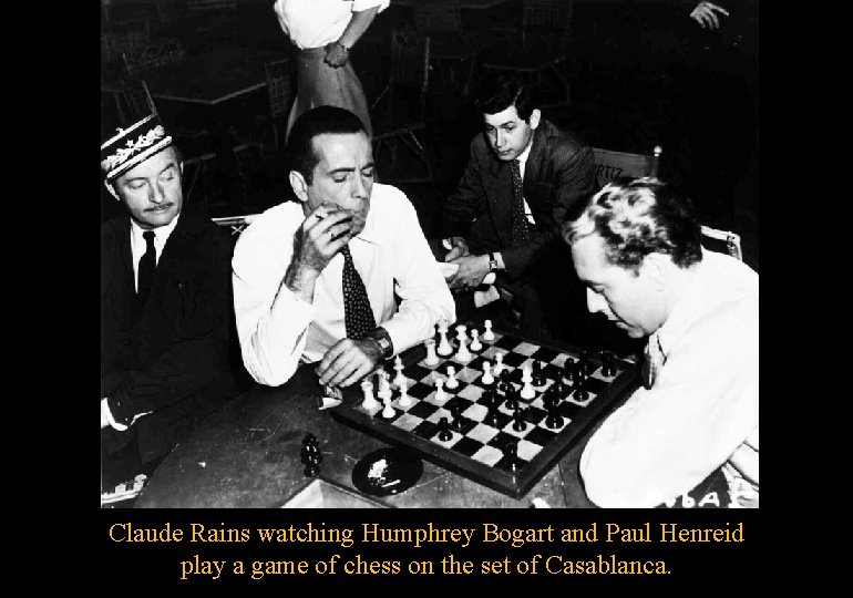 Claude Rains watching Humphrey Bogart and Paul Henreid play a game of chess on