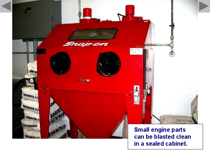 Small engine parts can be blasted clean in a sealed cabinet. 