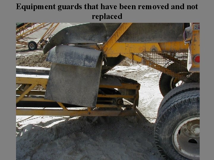 Equipment guards that have been removed and not replaced 
