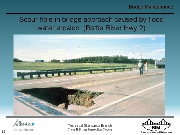 Bridge Maintenance Scour hole in bridge approach caused by flood water erosion. (Battle River