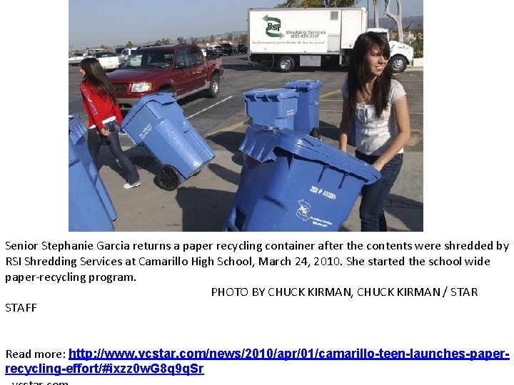 Senior Stephanie Garcia returns a paper recycling container after the contents were shredded by