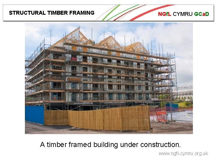 STRUCTURAL TIMBER FRAMING NGf. L CYMRU GCa. D A timber framed building under construction.