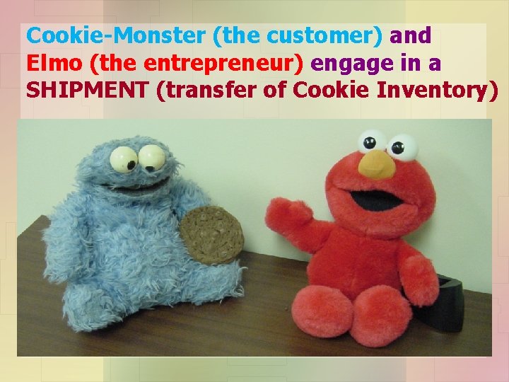 Cookie-Monster (the customer) and Elmo (the entrepreneur) engage in a SHIPMENT (transfer of Cookie