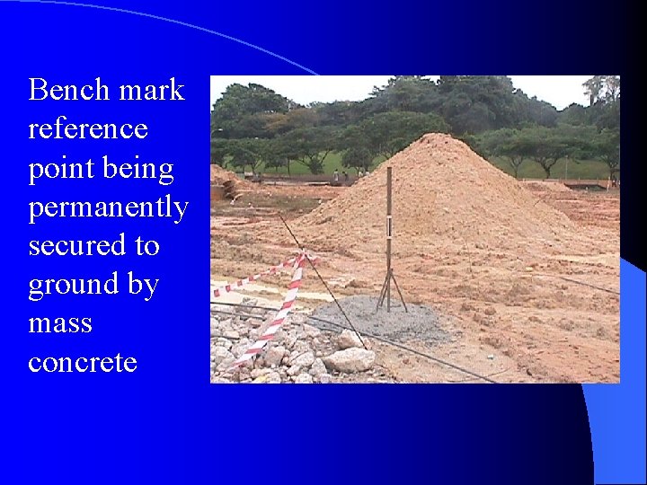 Bench mark reference point being permanently secured to ground by mass concrete 