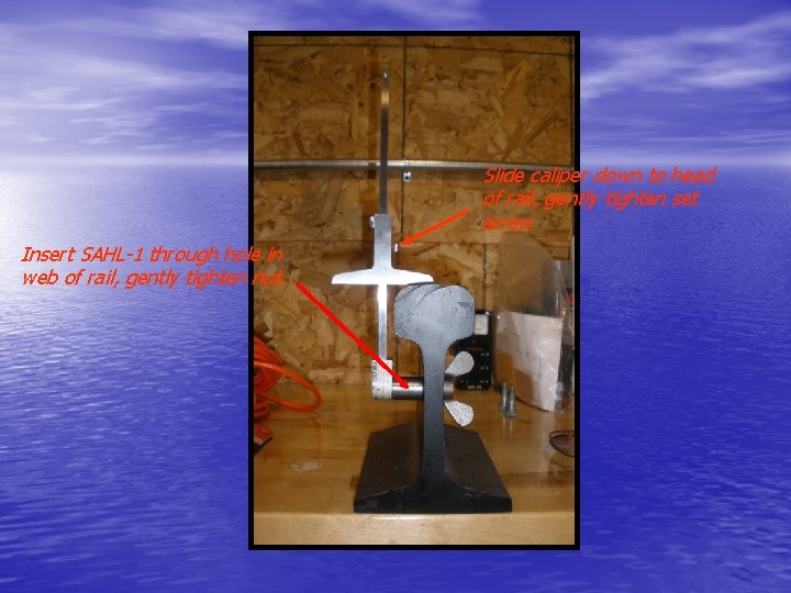 Slide caliper down to head of rail, gently tighten set screw Insert SAHL-1 through