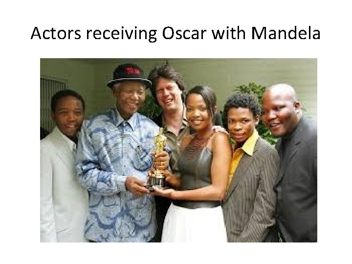 Actors receiving Oscar with Mandela 