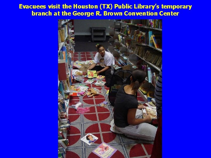 Evacuees visit the Houston (TX) Public Library’s temporary branch at the George R. Brown