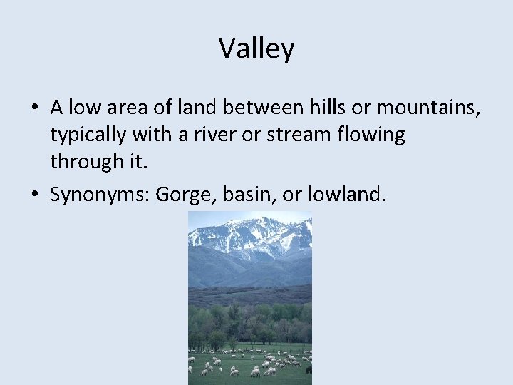 Valley • A low area of land between hills or mountains, typically with a