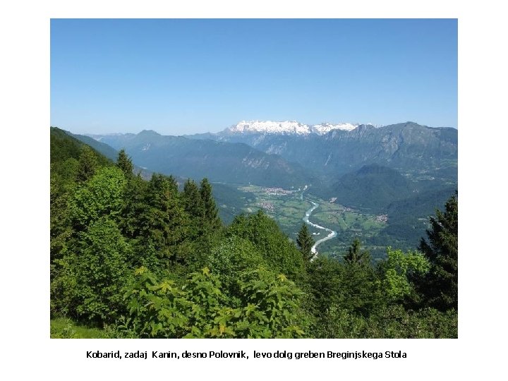 Kobarid, zadaj Kanin, desno Polovnik, levo dolg greben Breginjskega Stola 