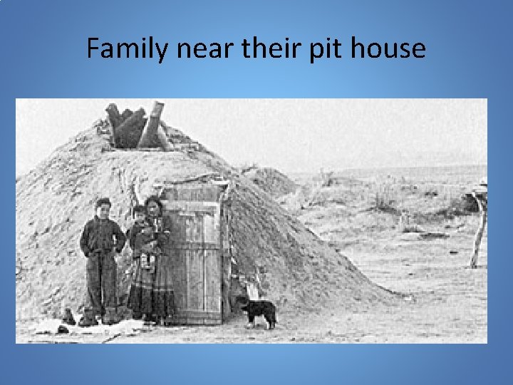 Family near their pit house 