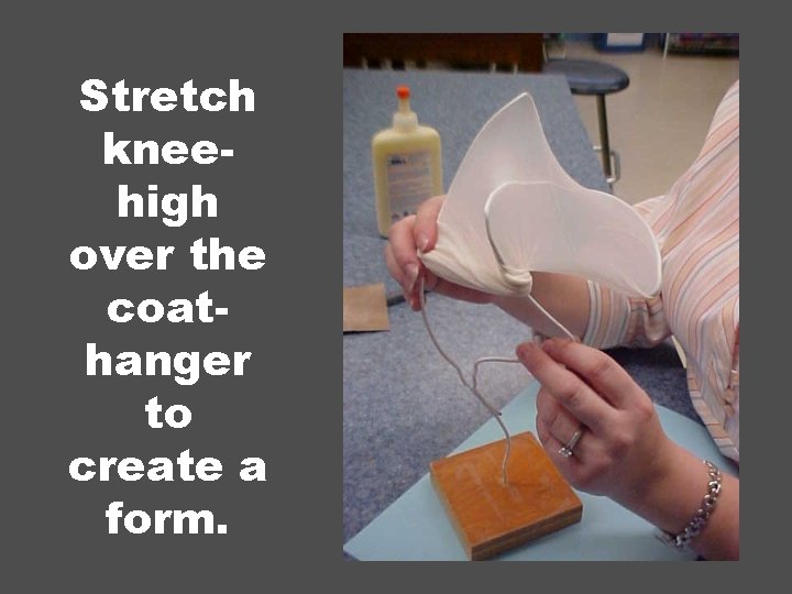 Stretch kneehigh over the coathanger to create a form. 