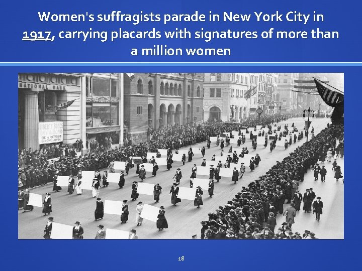 Women's suffragists parade in New York City in 1917, carrying placards with signatures of