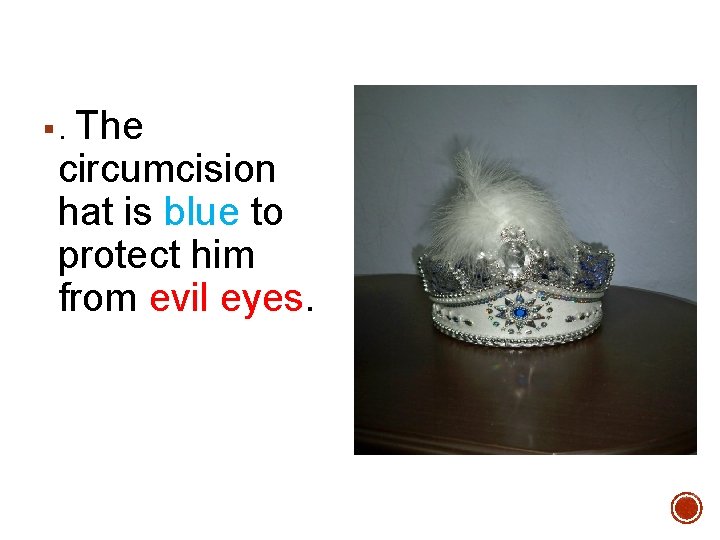 The circumcision hat is blue to protect him from evil eyes. §. 