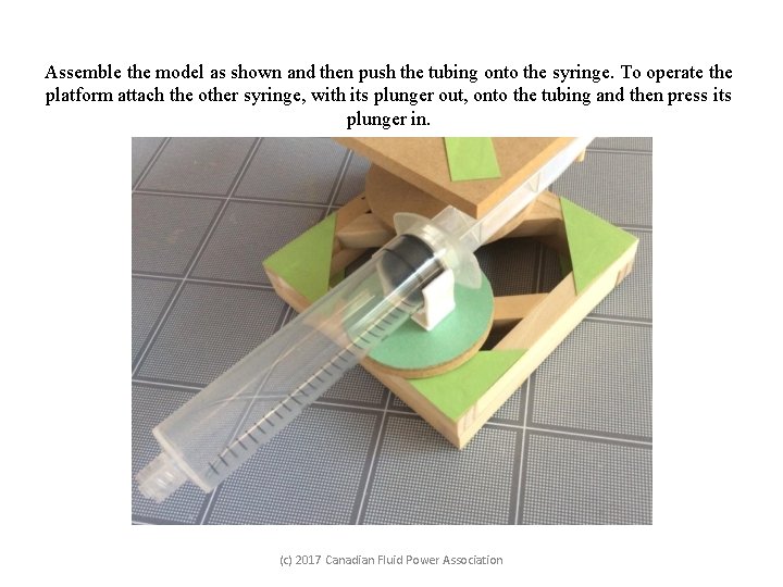 Assemble the model as shown and then push the tubing onto the syringe. To