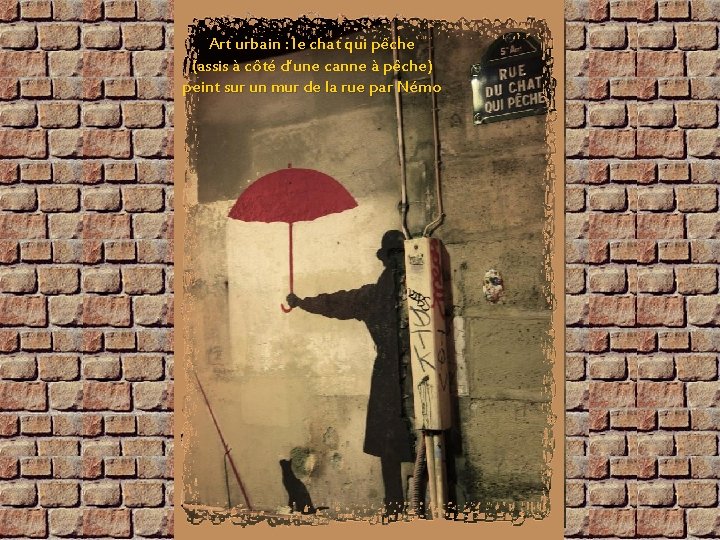 Art urbain : le chat qui pêche (assis à côté d’une canne à pêche)