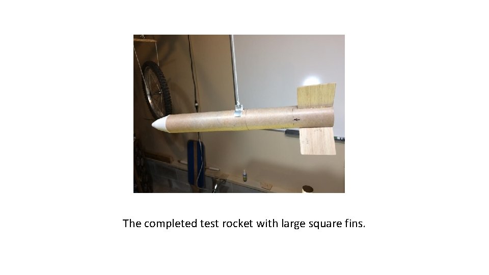 The completed test rocket with large square fins. 