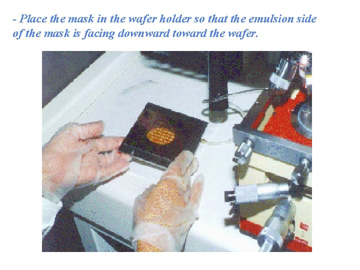 - Place the mask in the wafer holder so that the emulsion side of
