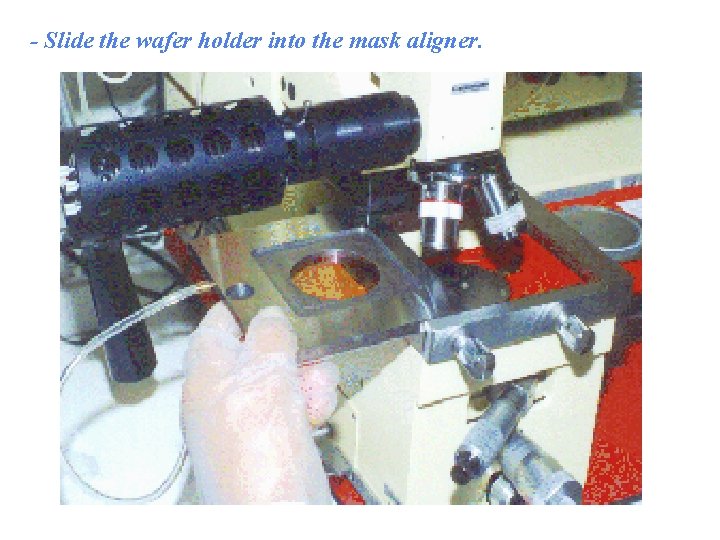- Slide the wafer holder into the mask aligner. 