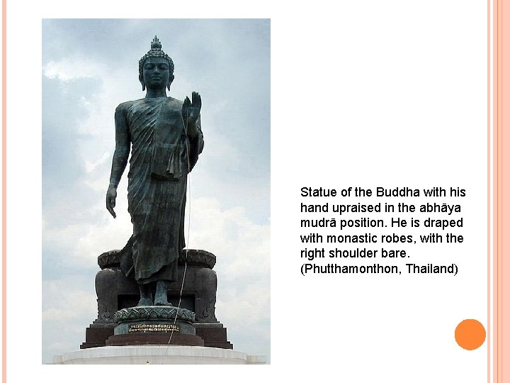 Statue of the Buddha with his hand upraised in the abhāya mudrā position. He
