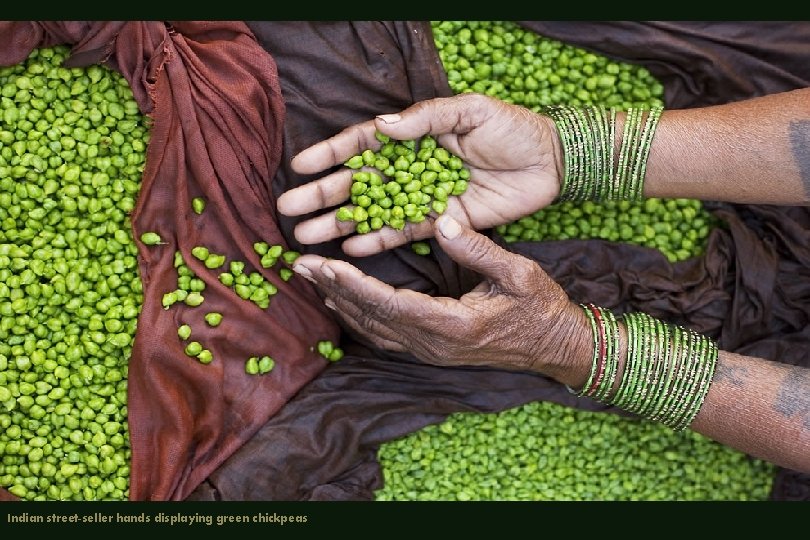 Indian street-seller hands displaying green chickpeas 