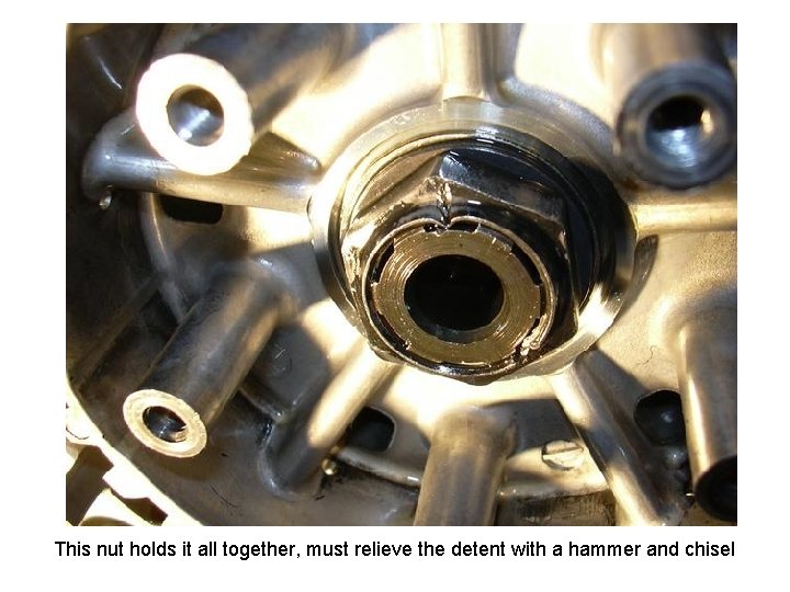 This nut holds it all together, must relieve the detent with a hammer and