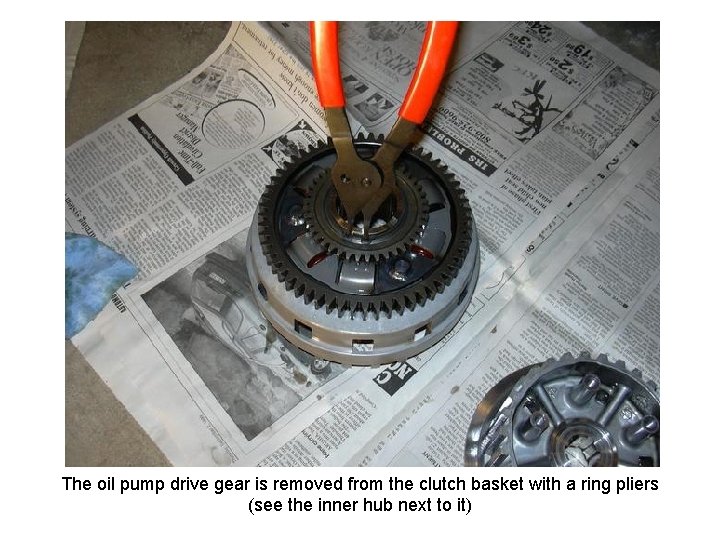 The oil pump drive gear is removed from the clutch basket with a ring