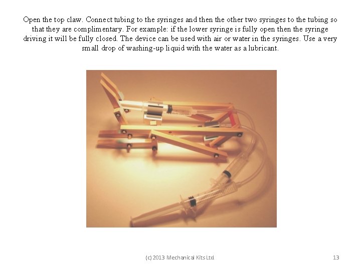 Open the top claw. Connect tubing to the syringes and then the other two