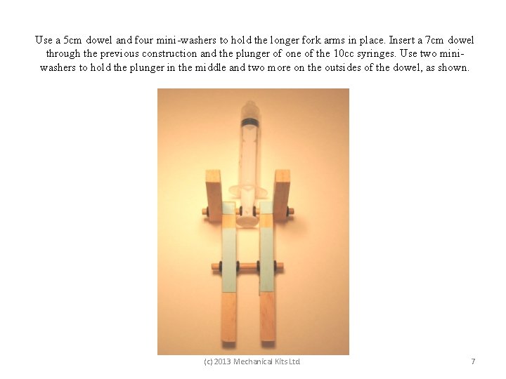 Use a 5 cm dowel and four mini-washers to hold the longer fork arms