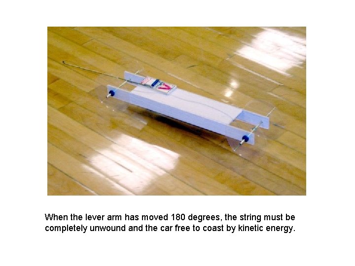 When the lever arm has moved 180 degrees, the string must be completely unwound