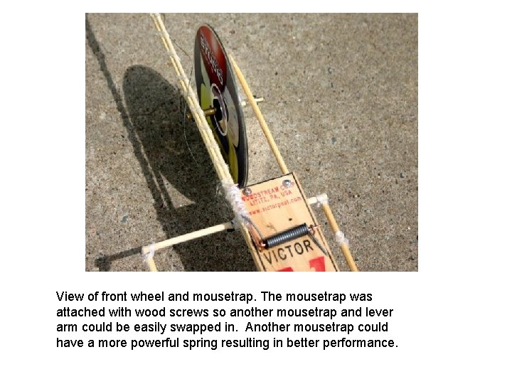 View of front wheel and mousetrap. The mousetrap was attached with wood screws so