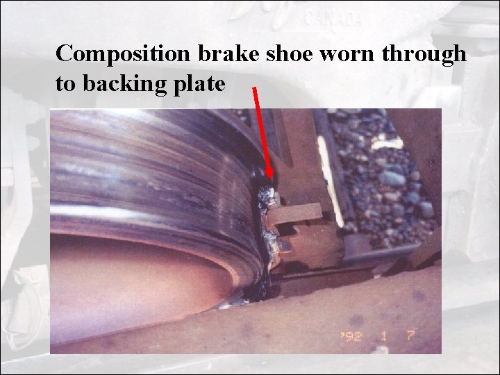 Composition brake shoe worn through to backing plate 