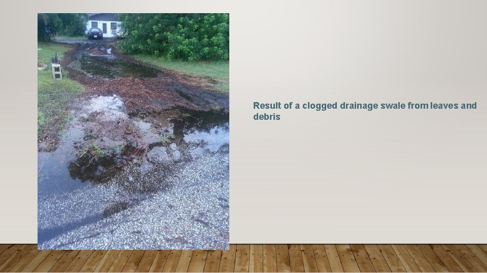 Result of a clogged drainage swale from leaves and debris 