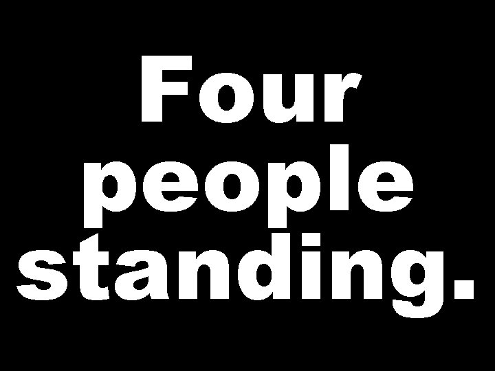 Four people standing. 