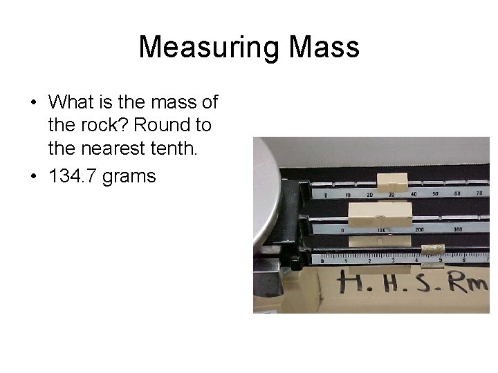 Measuring Mass • What is the mass of the rock? Round to the nearest