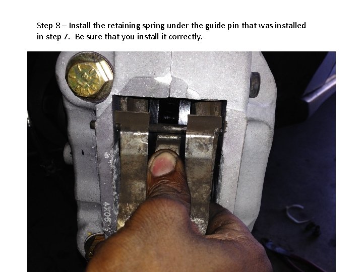 Step 8 – Install the retaining spring under the guide pin that was installed