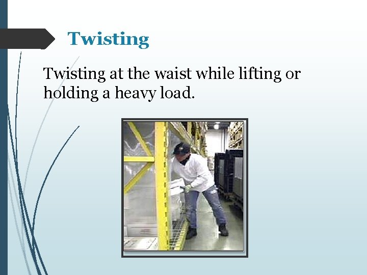 Twisting at the waist while lifting or holding a heavy load. 