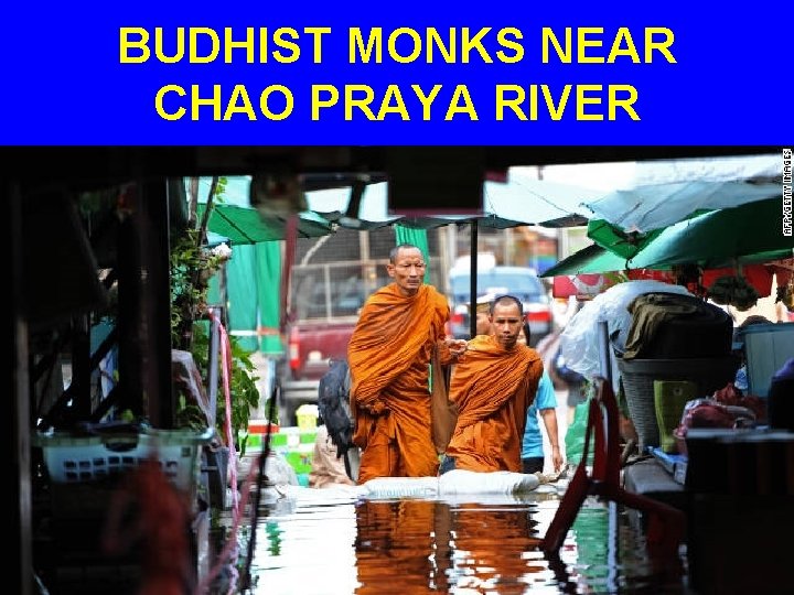BUDHIST MONKS NEAR CHAO PRAYA RIVER 