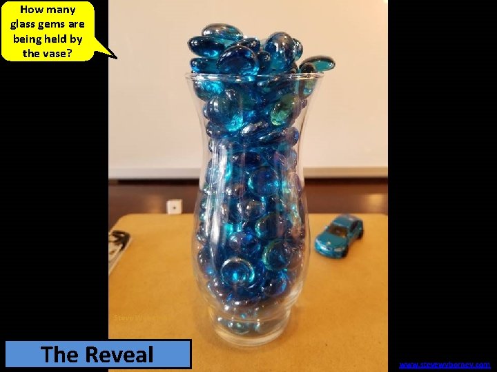 How many glass gems are being held by the vase? 193 The glass Reveal
