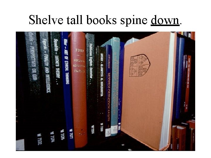 Shelve tall books spine down. 