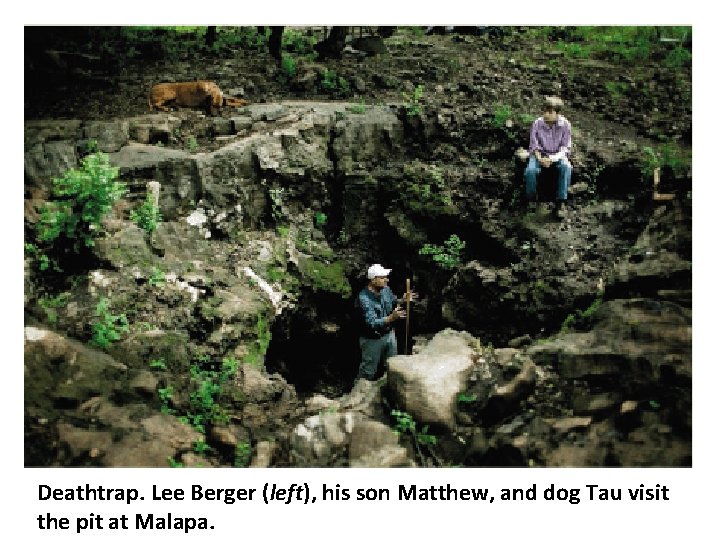 Deathtrap. Lee Berger (left), his son Matthew, and dog Tau visit the pit at