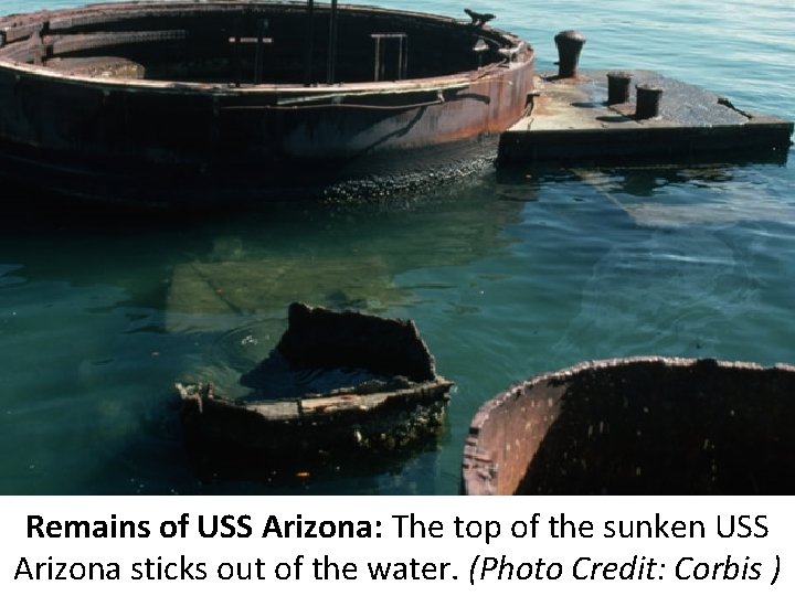 Remains of USS Arizona: The top of the sunken USS Arizona sticks out of