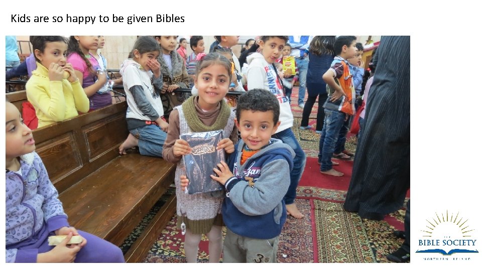 Kids are so happy to be given Bibles 