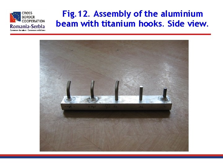 Fig. 12. Assembly of the aluminium beam with titanium hooks. Side view. Common borders.