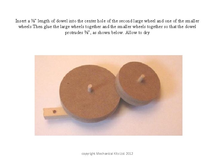 Insert a ⅞” length of dowel into the center hole of the second large