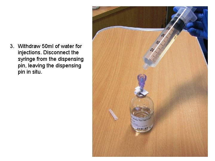 3. Withdraw 50 ml of water for injections. Disconnect the syringe from the dispensing