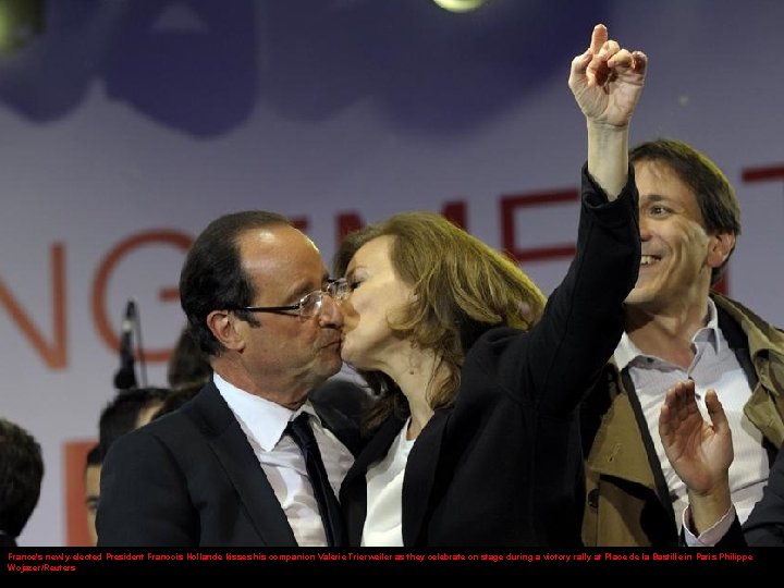 France's newly-elected President Francois Hollande kisses his companion Valerie Trierweiler as they celebrate on